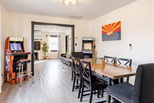 a dining room and living room with a table and chairs at Uptown Estates - Peak Haven - Stay Explore Belong in Flagstaff