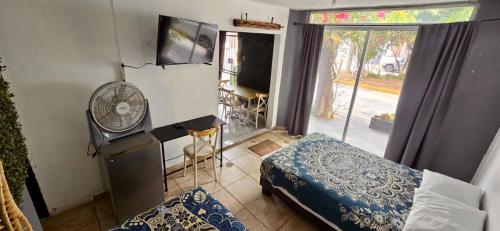 a bedroom with a room with a bed and a window at MINI HOTEL San Luis Potosí in San Luis Potosí