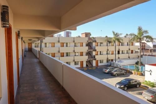 a balcony with a view of a parking lot at Hotel El Ejecutivo Tijuana in Tijuana