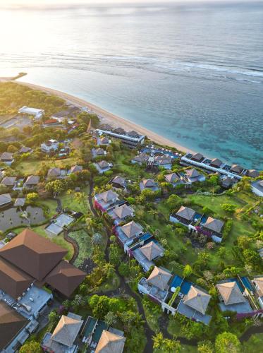 an aerial view of a resort next to the ocean at Samabe Bali Suites & Villas in Nusa Dua