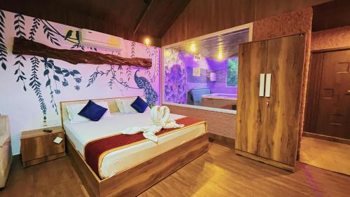 a bedroom with a bed in a room at Pepper Valley Resort in Kalpetta