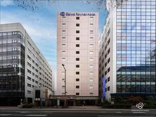 a large white building with a sign on it at Daiwa Roynet Hotel Hakata-Gion in Fukuoka