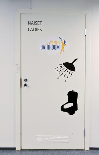 a door with a sign that reads master labs and a butterfly bathroom at CheapSleep Hostel Helsinki in Helsinki