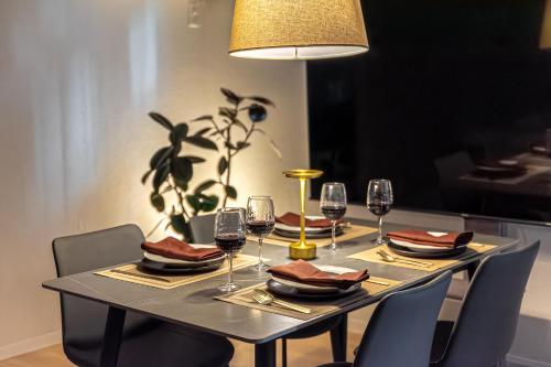 a table with glasses of wine on it at 15 min Shinjuku ! Kitchen,Laundry! Perfect for a Long Stay I many facilities nearby I Shinjuku,Tokyo in Tokyo