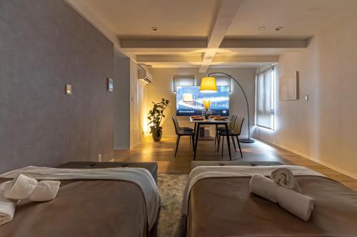 a hotel room with two beds and a dining room at 15 min Shinjuku ! Kitchen,Laundry! Perfect for a Long Stay I many facilities nearby I Shinjuku,Tokyo in Tokyo