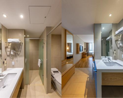 a large bathroom with a sink and a toilet at Best Western Hotel Gunsan in Gunsan-si