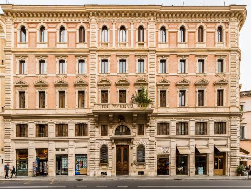 a large brick building on a city street at Affreschi Su Roma Luxury B&B in Rome