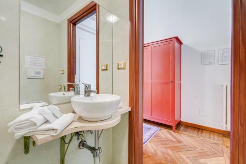 a bathroom with a sink and a mirror at Affreschi Su Roma Luxury B&B in Rome