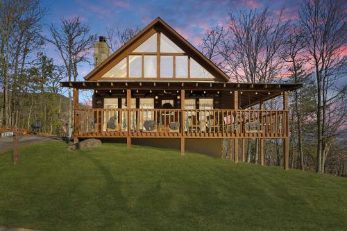 a large wooden house on top of a hill at Somewhere In Time cabin in Sevierville