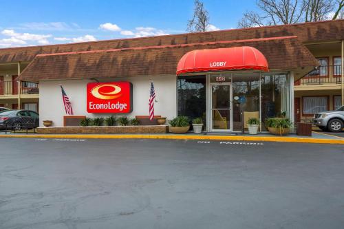 a mcdonalds restaurant with a red awning in a parking lot at Econo Lodge Williamsburg Historic Area in Williamsburg