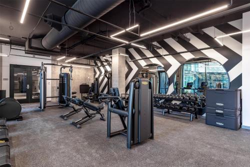 a gym with treadmills and exercise equipment in a room at Homewood Suites By Hilton Nashville Downtown The Gulch in Nashville