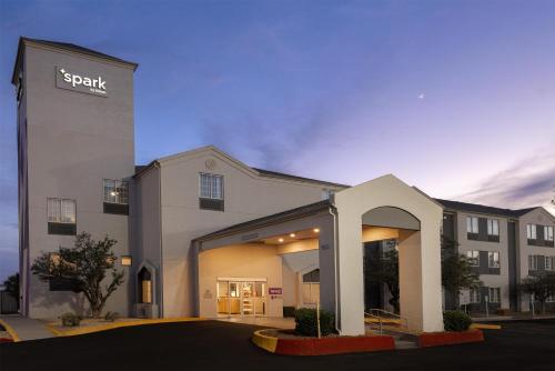 a building with a sap sign on the side of it at Spark by Hilton El Paso University in El Paso
