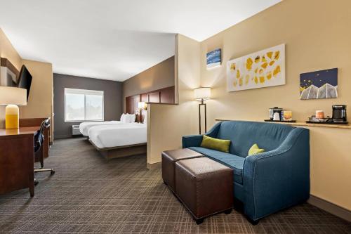 a hotel room with a couch and a bed at Comfort Suites Cullman I-65 Exit 310 in Cullman
