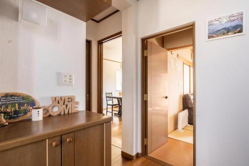 a kitchen with a wooden counter and a dining room at Blodge Lodge in Wazuka