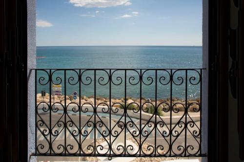 a view of the beach from a balcony at Hostal Boutique Casa del Mar Altea in Altea