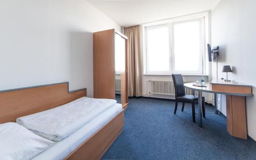 Postel nebo postele na pokoji v ubytování Hotel Sedes
