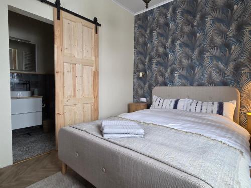 a bed with two pillows on it in a bedroom at Arashenda nest in Arashenda