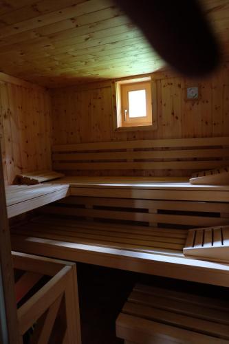 a wooden sauna with a small window in it at Ferienhaus Heutal in Unken