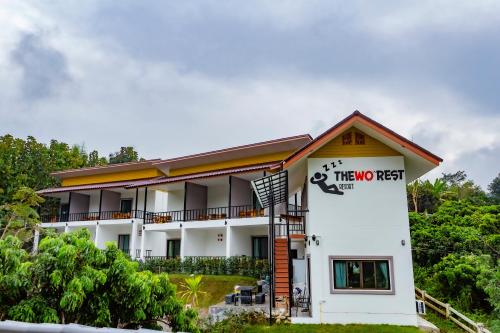a two two resort building with a sign on it at Lamtam Maesa Resort ลำธารแม่สา รีสอร์ท in Mae Rim