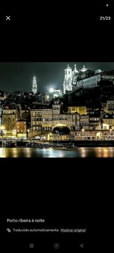 a view of a city at night with buildings at portochique AL7 in Porto