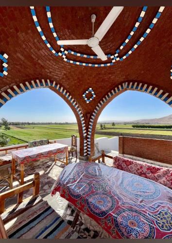 a large room with a large clock on the wall at Quiet Gate Guest House in Al Aqālitah