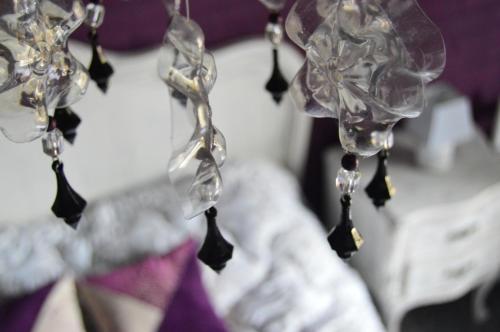 a bunch of wine glasses hanging from a string at VIAJERO Posada & Hostel Punta del este in Punta del Este