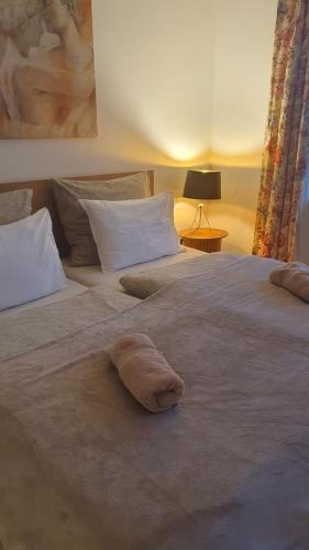 a towel laying on a bed in a bedroom at Apartmán Lukas s KRBEM v centru in Karviná