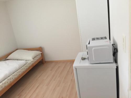 Ένα ή περισσότερα κρεβάτια σε δωμάτιο στο Hostel Airport