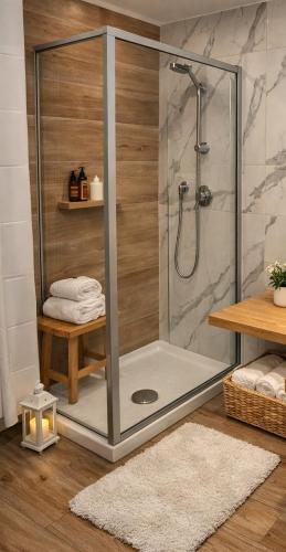 a shower with a glass door in a bathroom at NaMi in Battipaglia