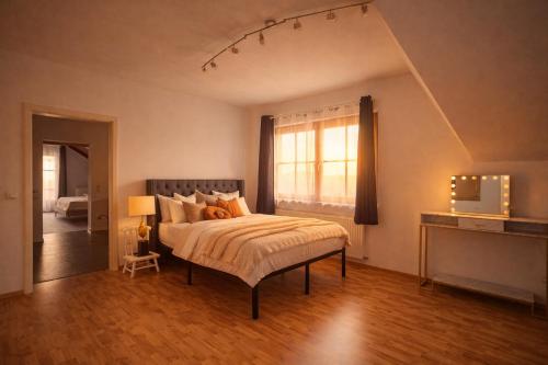 a bedroom with a bed and a window at Villa mit Pool und Garten in Thalheim bei Wels