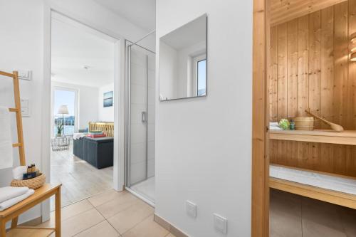 a bathroom with a glass shower in a house at Annas Heimat am Meer in Kappeln
