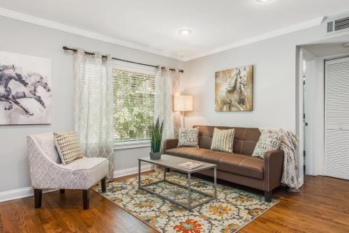 a living room with a couch and a table at Amazing Midtown Atlanta Location by Piedmont Park Beltline Ponce City Market in Atlanta