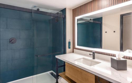 a bathroom with a sink and a shower at Hilton Phoenix Resort at the Peak in Phoenix