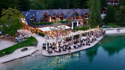 an aerial view of a resort on the water at JASNA NATUR Resort by the lake in Kranjska Gora