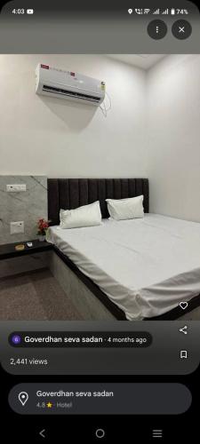a bedroom with a bed with a heater on the wall at Shri shyam hotel and restorent in Govardhan