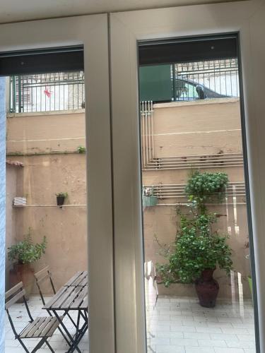 a view of a patio through a sliding glass door at Mama House in Naples