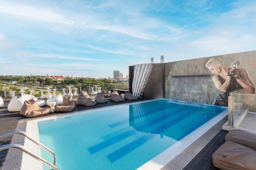 a swimming pool on the roof of a building at HF Fénix Music in Lisbon