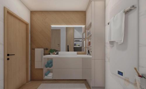 a bathroom with a sink and a mirror at Miti Apartment with Marina View & Spa Access in Veliko Gradište