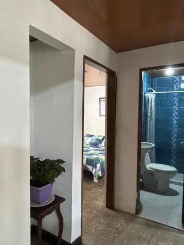 a room with a bathroom with a toilet and a sink at The Cats Nail house in Cali