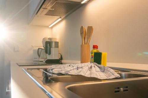 a kitchen sink with a towel sitting on it at Villa Cremona in Bansin