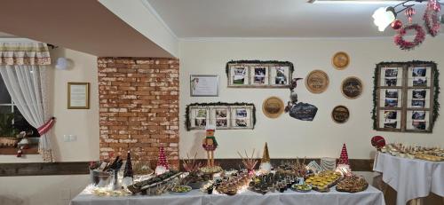 a room with a table with christmas items on it at Guest House Čater in Laško