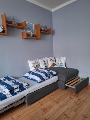 two beds sitting next to each other in a room at Mieszkanie przy plaży Ela in Dziwnów
