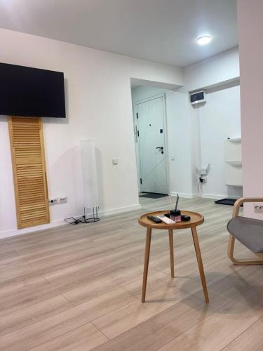 a living room with a coffee table and a couch at Loft Like View in Izmail