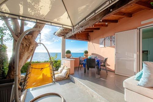a view of the ocean from the balcony of a house at SEAHORSEROOM - Frontemare con Idromassaggio in Finale Ligure