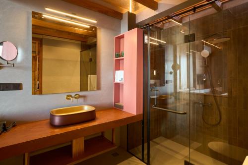 a bathroom with a sink and a shower at Wishing Tree Boutique Resort and Spa - Haputale's Panoramic Hideaway in Haputale
