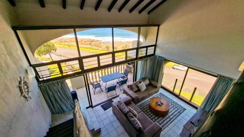 an overhead view of a living room with a balcony at Uvongo Cabanas 13B in Uvongo Beach