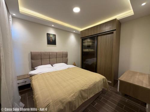 a bedroom with a large bed and a closet at Casa Sole Sharm Hills Apt 4 in Sharm El Sheikh