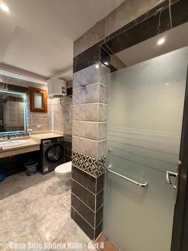 a bathroom with a shower with a toilet and a sink at Casa Sole Sharm Hills Apt 4 in Sharm El Sheikh