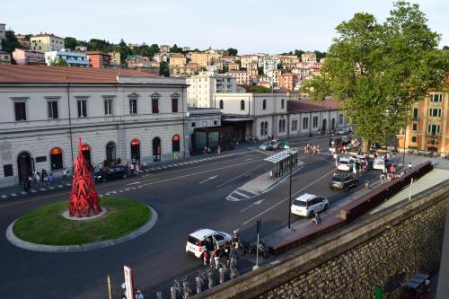 a city street with cars parked on the road at Hotel Mary in La Spezia