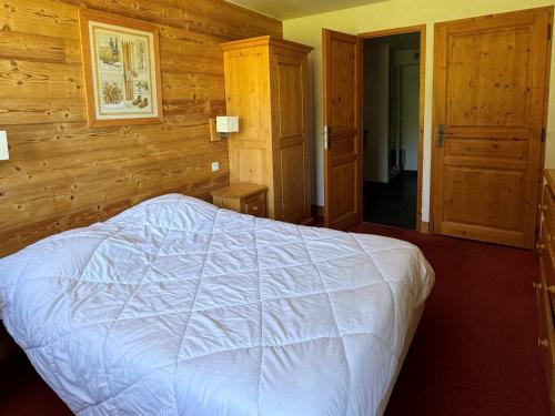 Appartement cosy avec accès direct aux pistes, espace bien-être et piscine chauffée